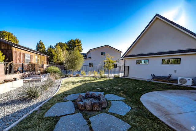 1283 North Gallen Road Santa Clara, UT 84765 - Photo 59 of 103 Fenced backyard featuring a patio and an outdoor fire pit