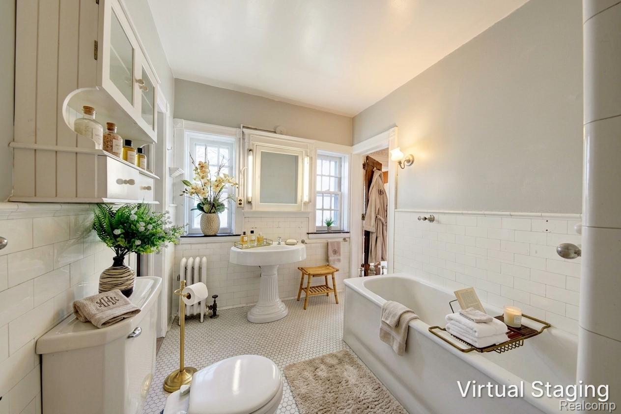 121 Longfellow Street Detroit, MI 48202 - Photo 42 of 87 Bathroom with tile walls, a wainscoted wall, radiator heating unit, and tile patterned floors