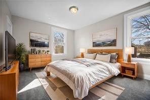 9600 Frankstown Road Pittsburgh, PA 15235 - Photo 10 of 28 a bedroom with a bed a couch and a window