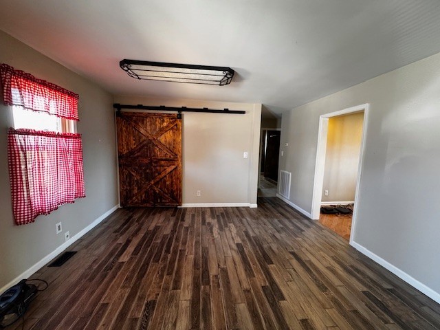 442 Shady Grove Road Flintville, TN 37335 - Photo 8 of 44 a view of an empty room with wooden floor and a window