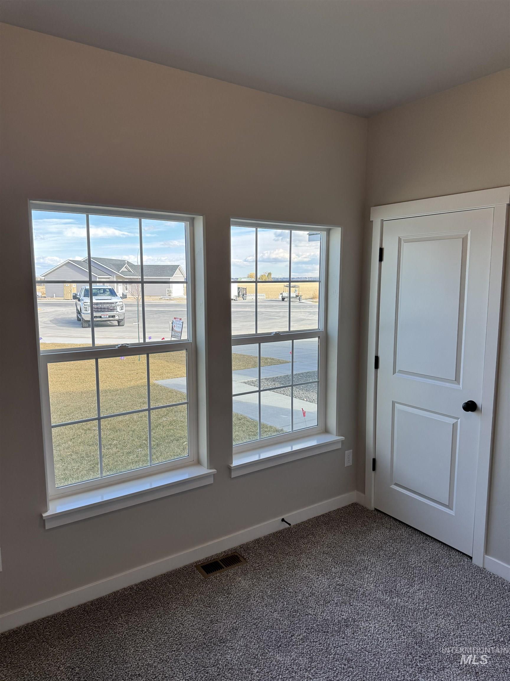 2064 Harrison Street South Twin Falls, ID 83301 - Photo 11 of 29 Empty room with baseboards and carpet flooring