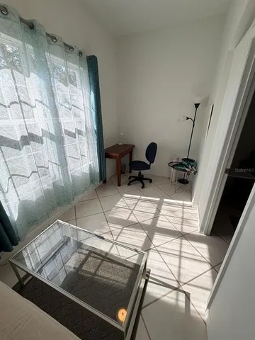 a dirty bathroom with a granite countertop sink