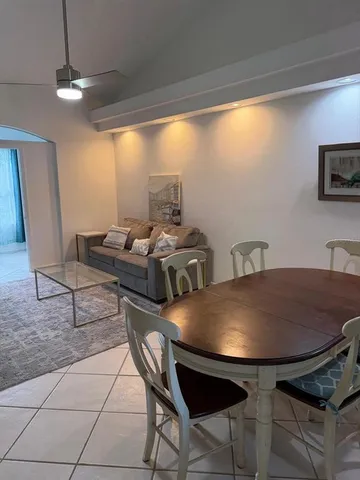 a view of a dining room with furniture