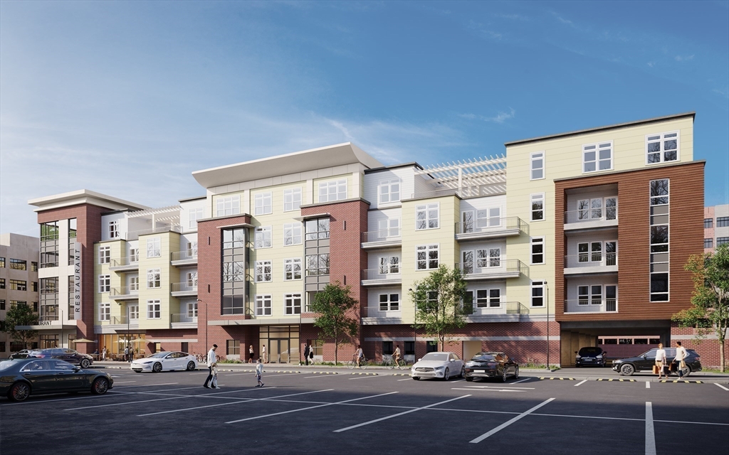 62 Foundry Street, Unit 401 Wakefield, MA 01880 - Photo 17 of 17 a city street lined with buildings and cars parked