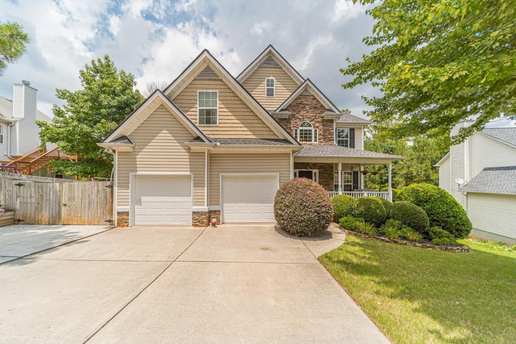 a front view of a house with a yard