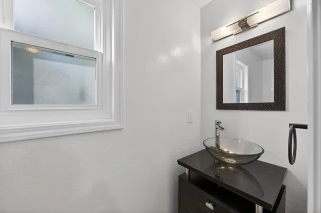 a view of a balcony with wooden floor