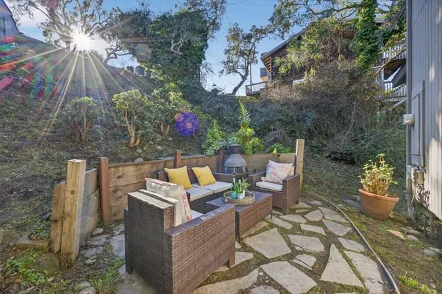 a aerial view of a house with a yard garage and lake view