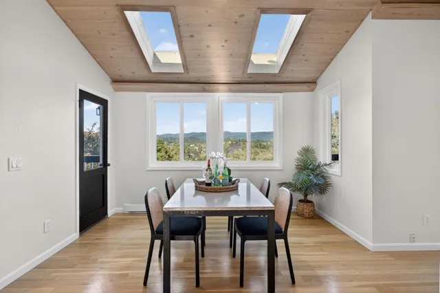 a dining room with furniture and window