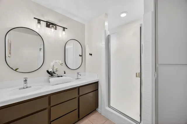 a bedroom with a bed and a chair