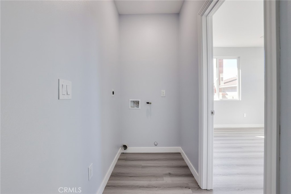 11875 Wisteria Avenue, Unit ADU Fountain Valley, CA 92708 - Photo 13 of 14 a view of a hallway with wooden floor