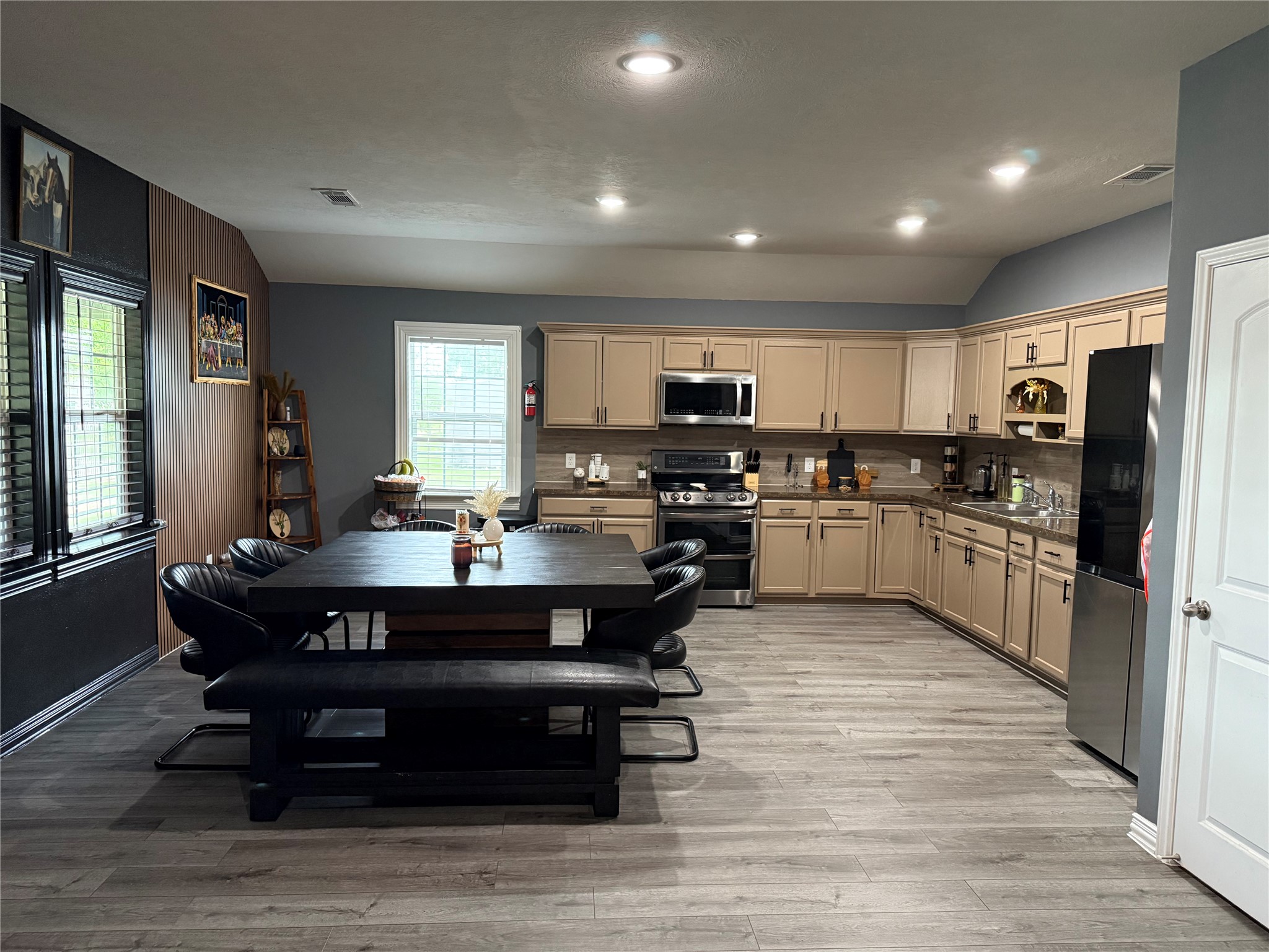13125 1st Street Kendleton, TX 77417 - Photo 5 of 23 a large kitchen with kitchen island a sink table and chairs