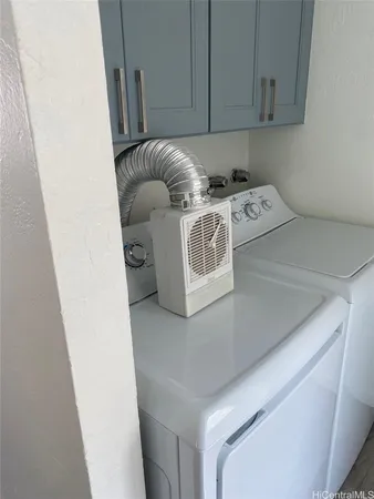 a white toilet sitting in a bathroom next to a window