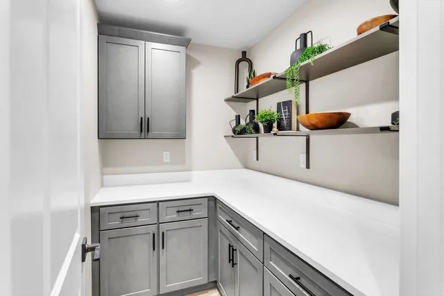 a kitchen with a sink and cabinets