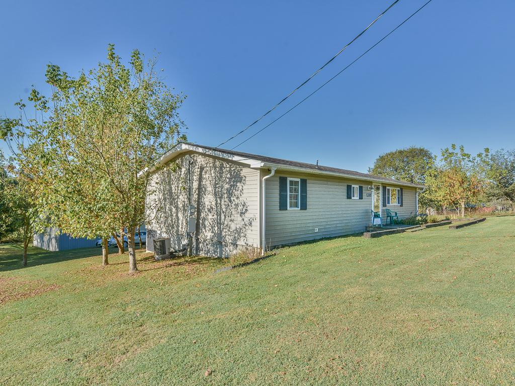 369 Miller Road Telford, TN 37690 - Photo 2 of 36 Left side of home