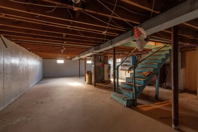 a view of an empty room with wooden walls