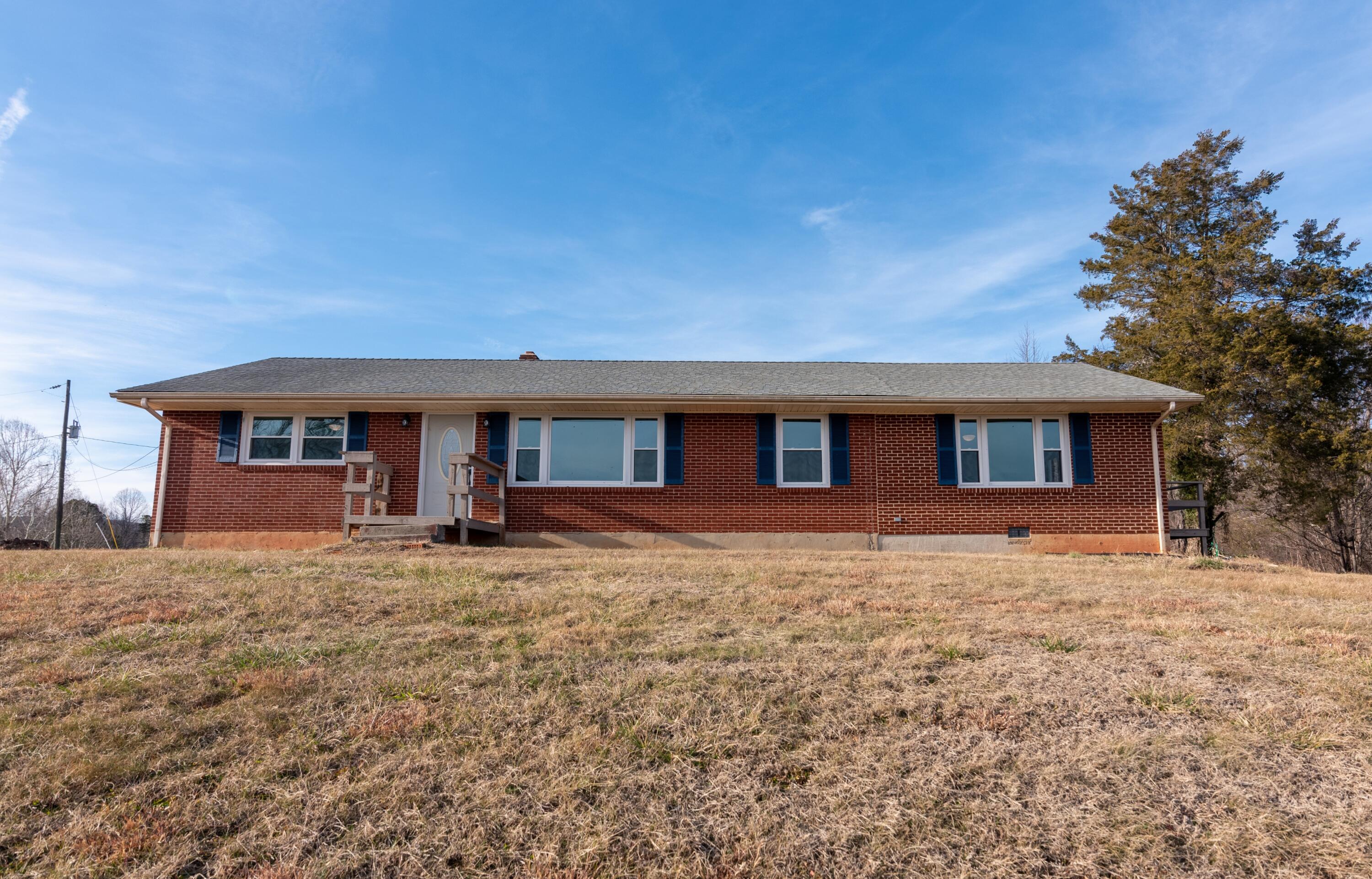1079 Mountain Valley Road Vinton, VA 24179 - Photo 27 of 29 a front view of a house with yard and seating area
