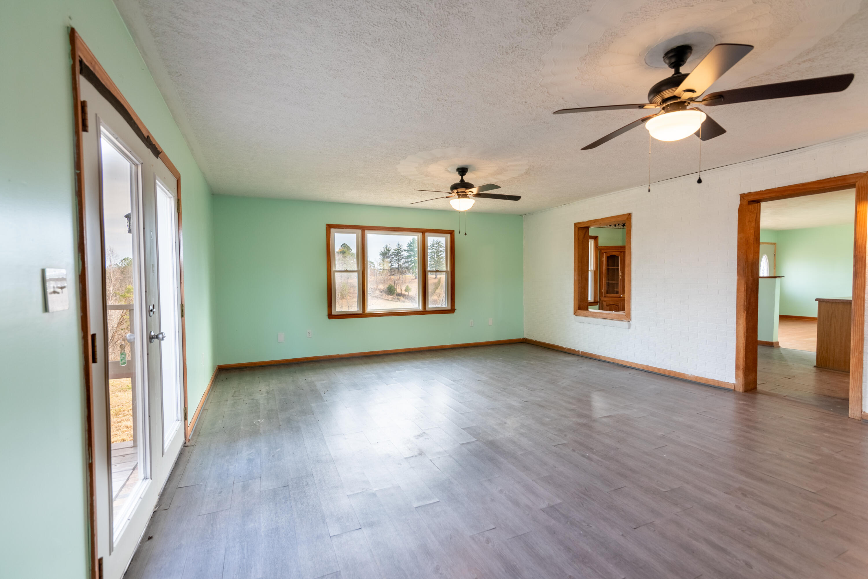 1079 Mountain Valley Road Vinton, VA 24179 - Photo 5 of 29 a view of a livingroom with a ceiling fan and window