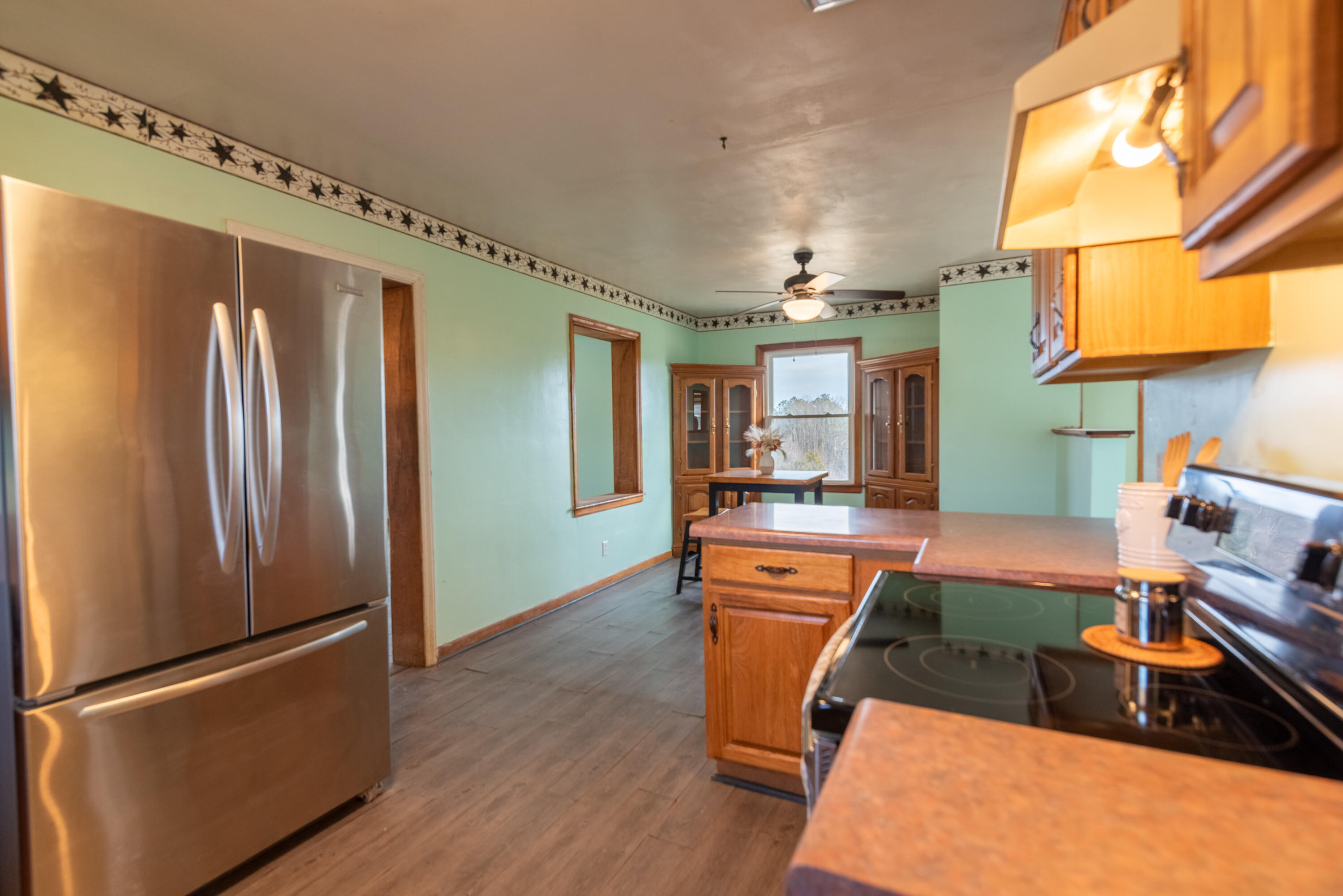 1079 Mountain Valley Road Vinton, VA 24179 - Photo 8 of 29 a kitchen with stainless steel appliances granite countertop a refrigerator and a stove