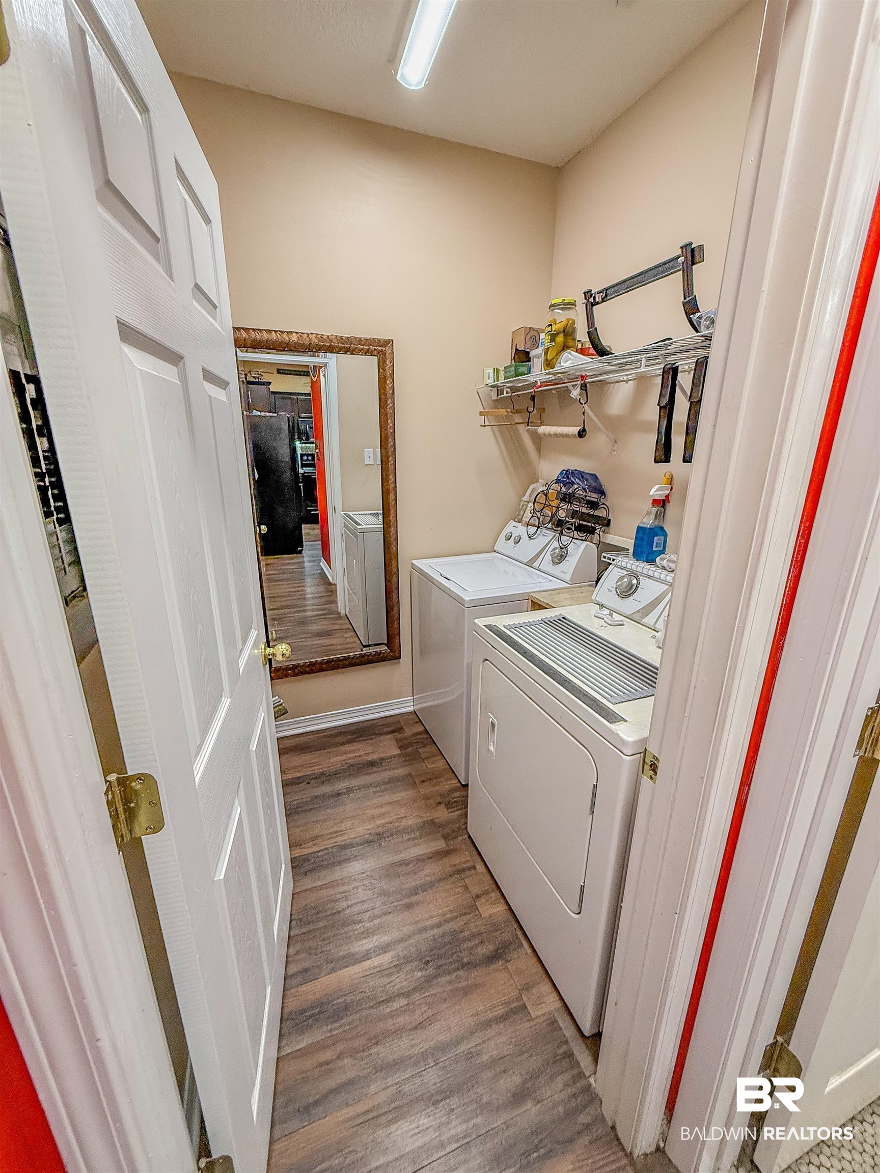 2651 South Juniper Street Foley, AL 36535 - Photo 10 of 20 Washroom with dark wood finished floors and washing machine and clothes dryer