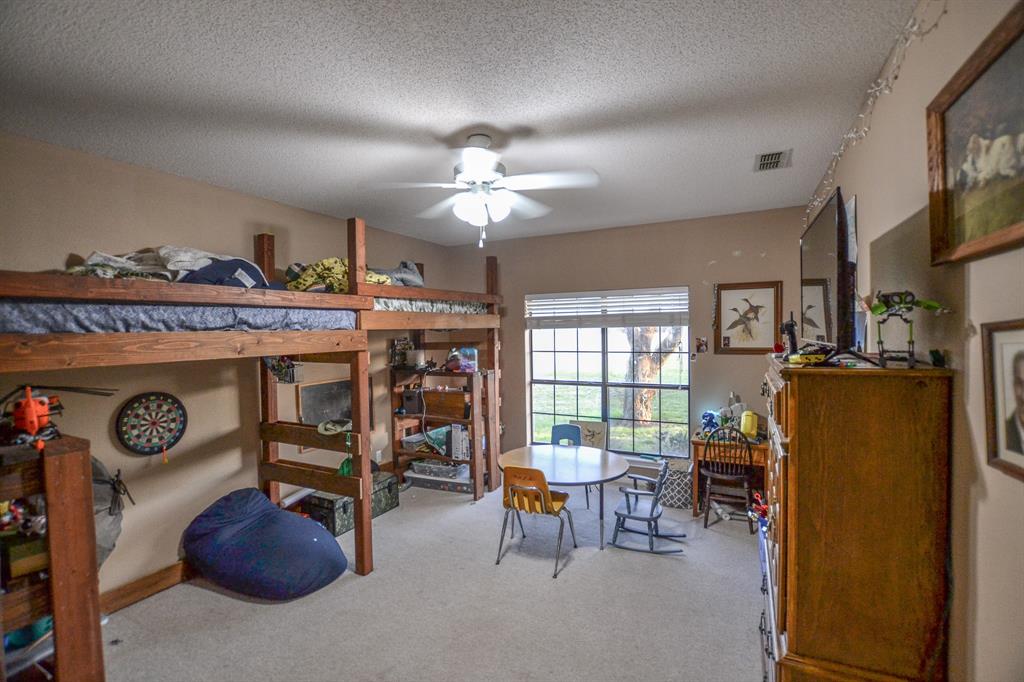 1392 Highway 69 Point, TX 75472 - Photo 39 of 40 a view of a livingroom with furniture and a flat screen tv