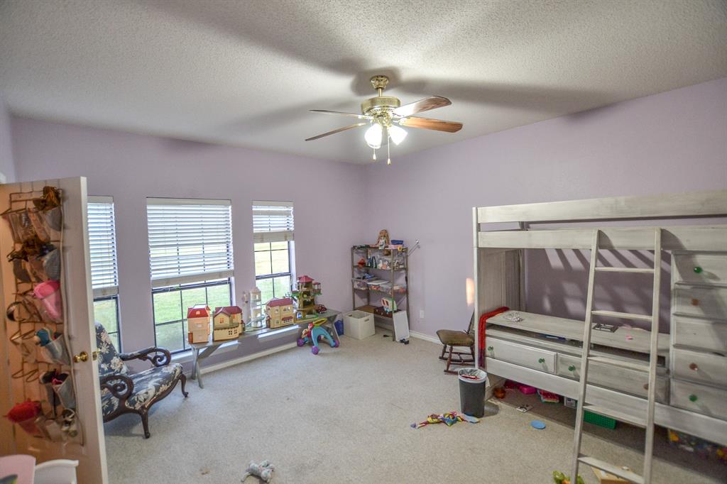 1392 Highway 69 Point, TX 75472 - Photo 40 of 40 a bedroom with furniture a window and a ceiling fan