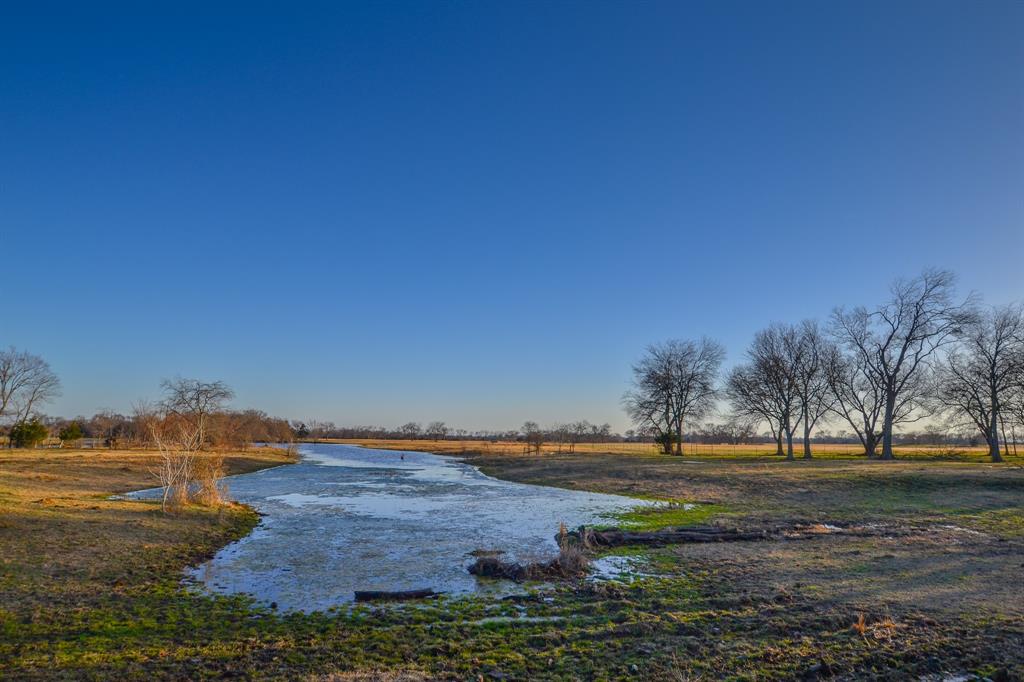 1392 Highway 69 Point, TX 75472 - Photo 8 of 40 a view of a lake with a big yard
