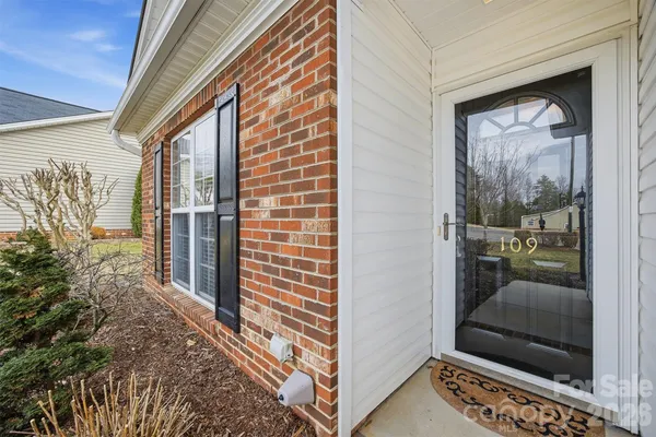 a view of a door and chair in a room