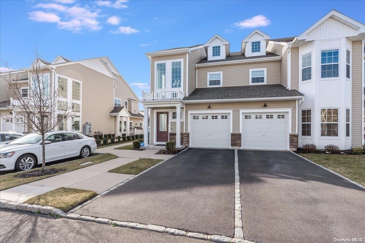 40 Halley Drive, Unit 2 Blue Point, NY 11772 - Photo 1 of 1 a view of a house with a parking space