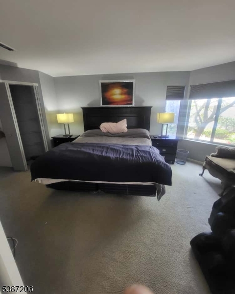 1203 Jesse Way Piscataway, NJ 08854 - Photo 2 of 12 a bedroom with a bed and window