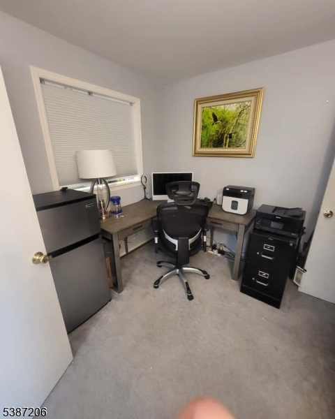 1203 Jesse Way Piscataway, NJ 08854 - Photo 3 of 12 a view of a livingroom with workspace and a couch