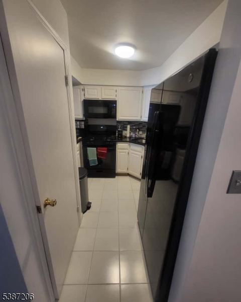 1203 Jesse Way Piscataway, NJ 08854 - Photo 7 of 12 a view of a refrigerator in a kitchen