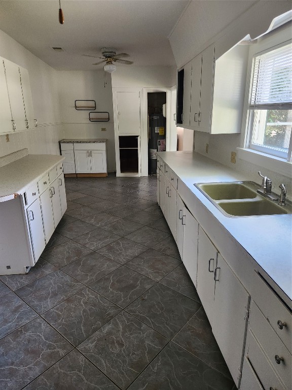 1400 Dyer Avenue Rosenberg, TX 77471 - Photo 13 of 20 a large kitchen with cabinets a sink and a stove