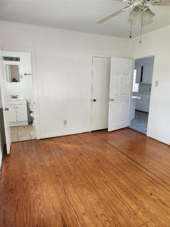 1400 Dyer Avenue Rosenberg, TX 77471 - Photo 15 of 20 a view of a room with wooden floor and cabinet