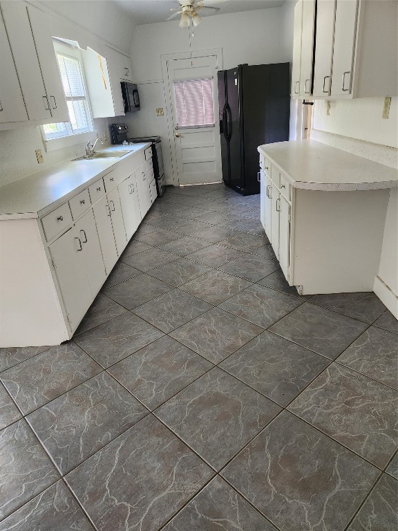 1400 Dyer Avenue Rosenberg, TX 77471 - Photo 16 of 20 a kitchen with cabinets and a stove top oven