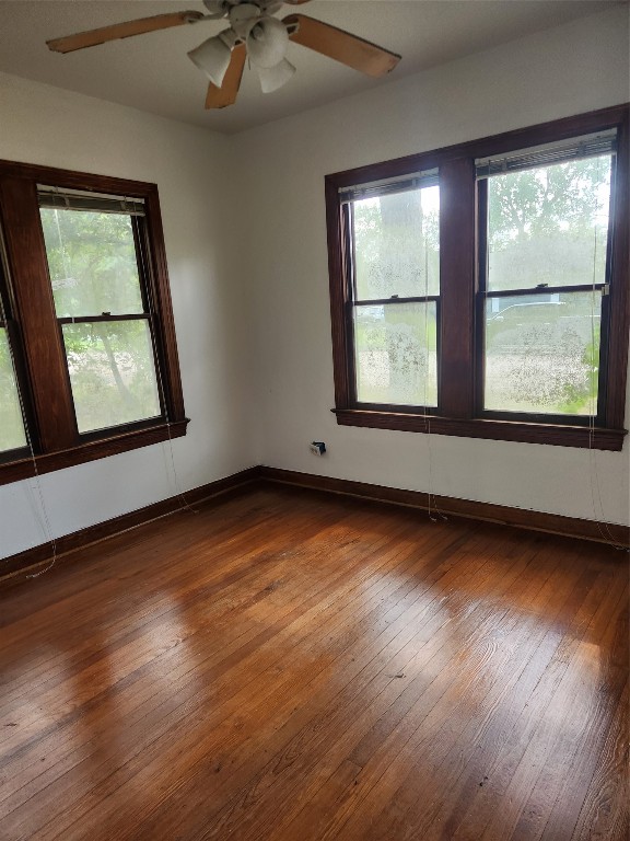 1400 Dyer Avenue Rosenberg, TX 77471 - Photo 8 of 20 an empty room with wooden floor and windows
