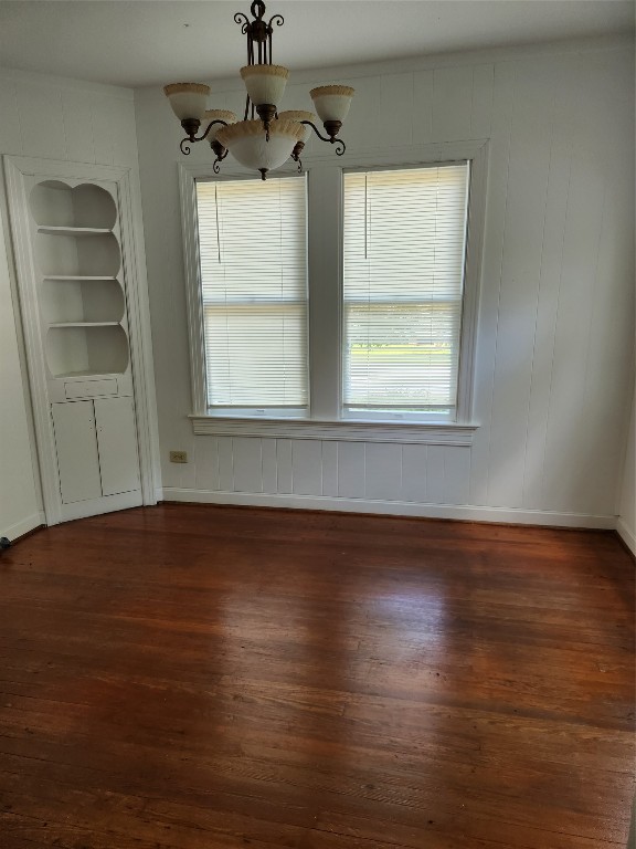 1400 Dyer Avenue Rosenberg, TX 77471 - Photo 9 of 20 an empty room with wooden floor and windows