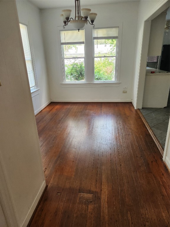 1400 Dyer Avenue Rosenberg, TX 77471 - Photo 10 of 20 an empty room with wooden floor and windows