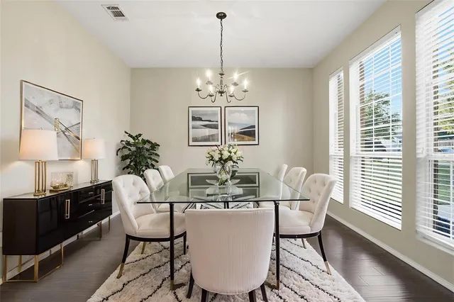 a dining room with furniture and window