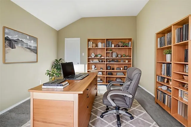 a view of a workspace with furniture