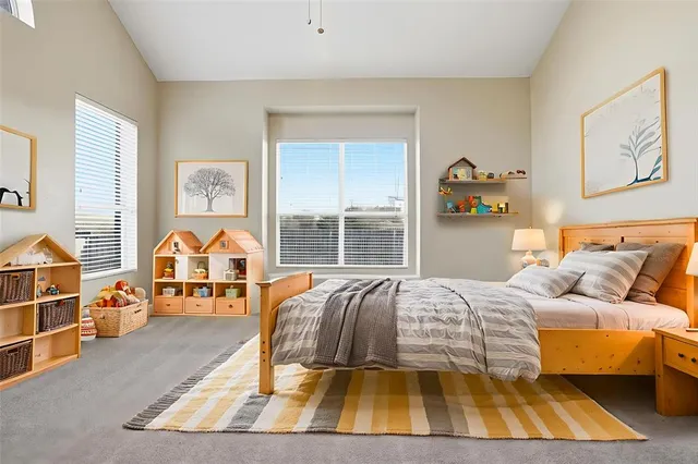 a bedroom with a bed and window