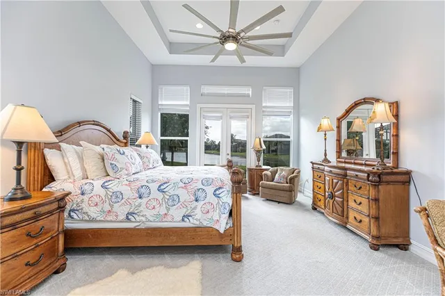 a bedroom with a bed couch and window