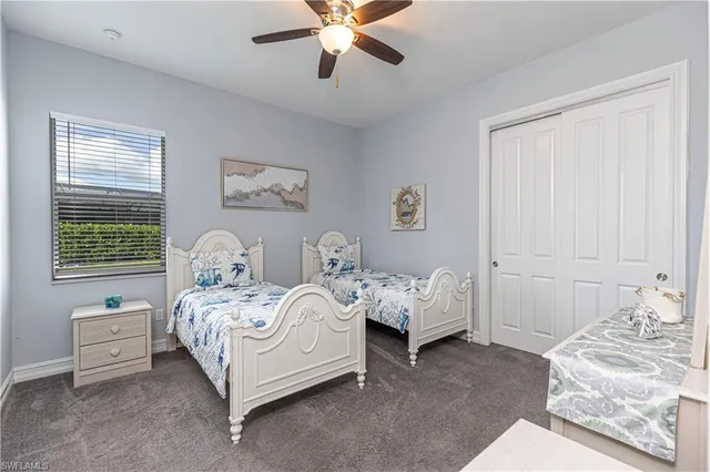 a bedroom with bed and a window