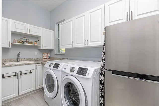 a view of storage and utility room with washer and dryer