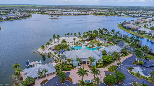 an aerial view of a house with a lake view