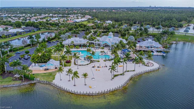an aerial view of a house with a lake view