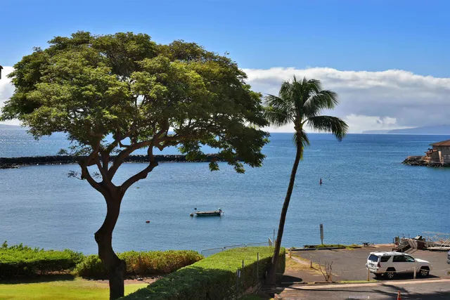 a view of a car parked in front of a house