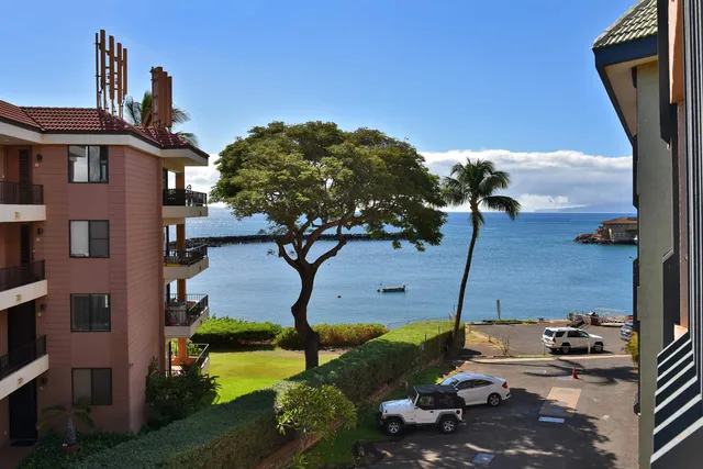 a aerial view of a house with a yard
