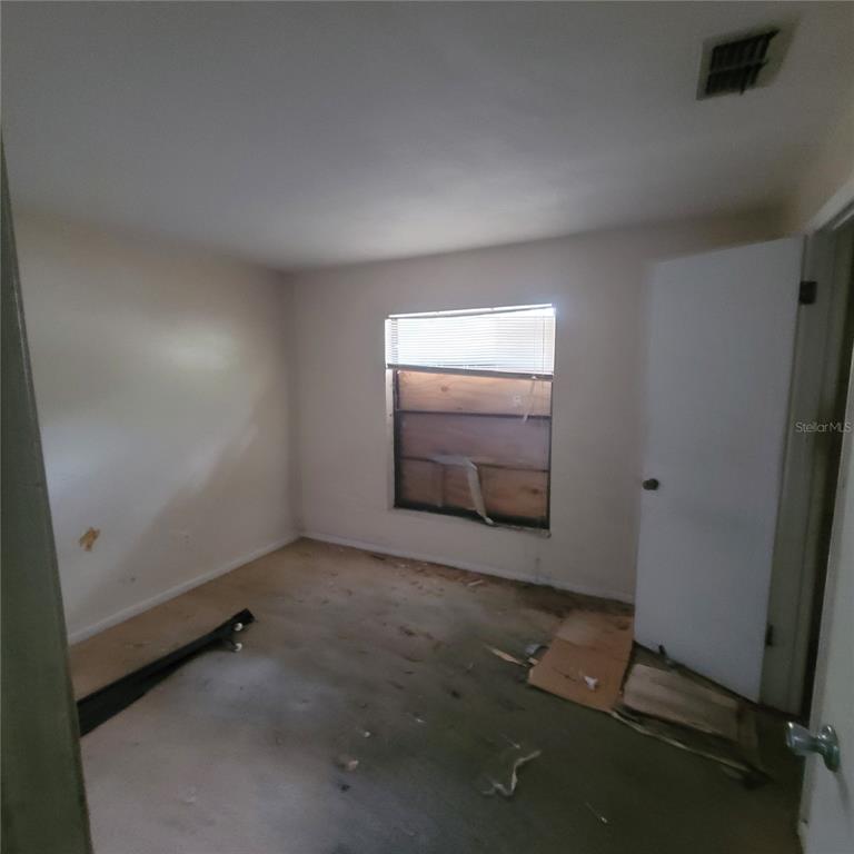 2224 Southwest 39 Drive Gainesville, FL 32607 - Photo 11 of 11 an empty room with a empty space and window