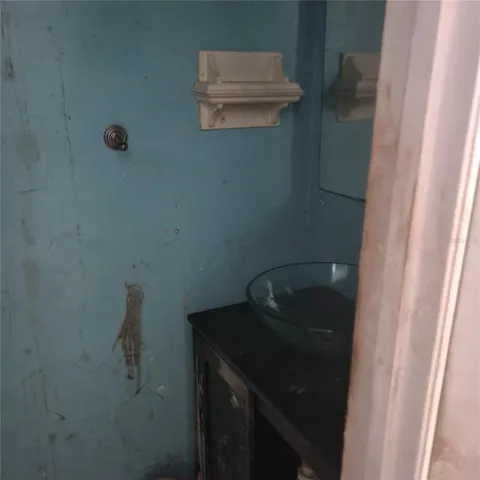 a bathroom with a sink and vanity