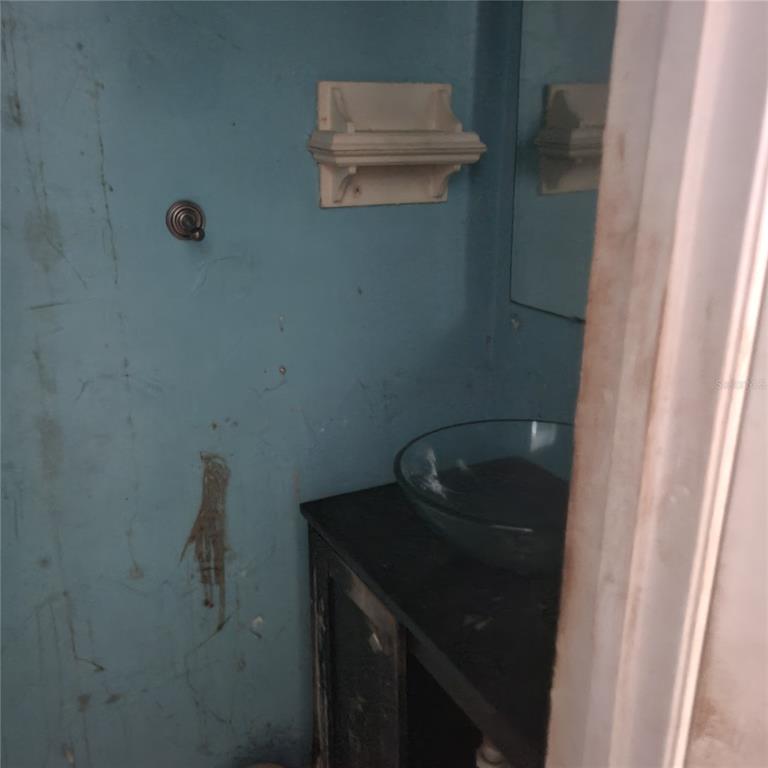 2224 Southwest 39 Drive Gainesville, FL 32607 - Photo 8 of 11 a bathroom with a sink and vanity